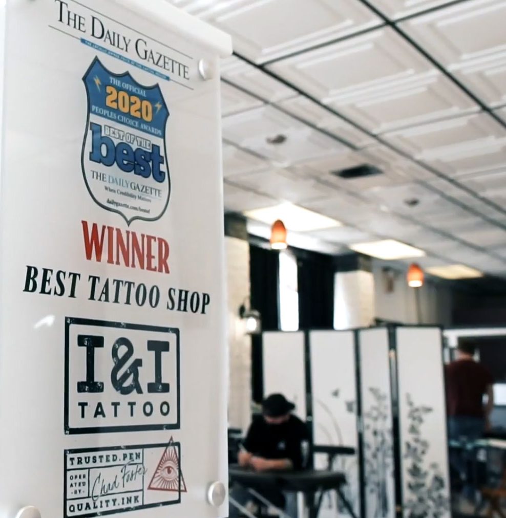 Photo of a woman getting a tattoo